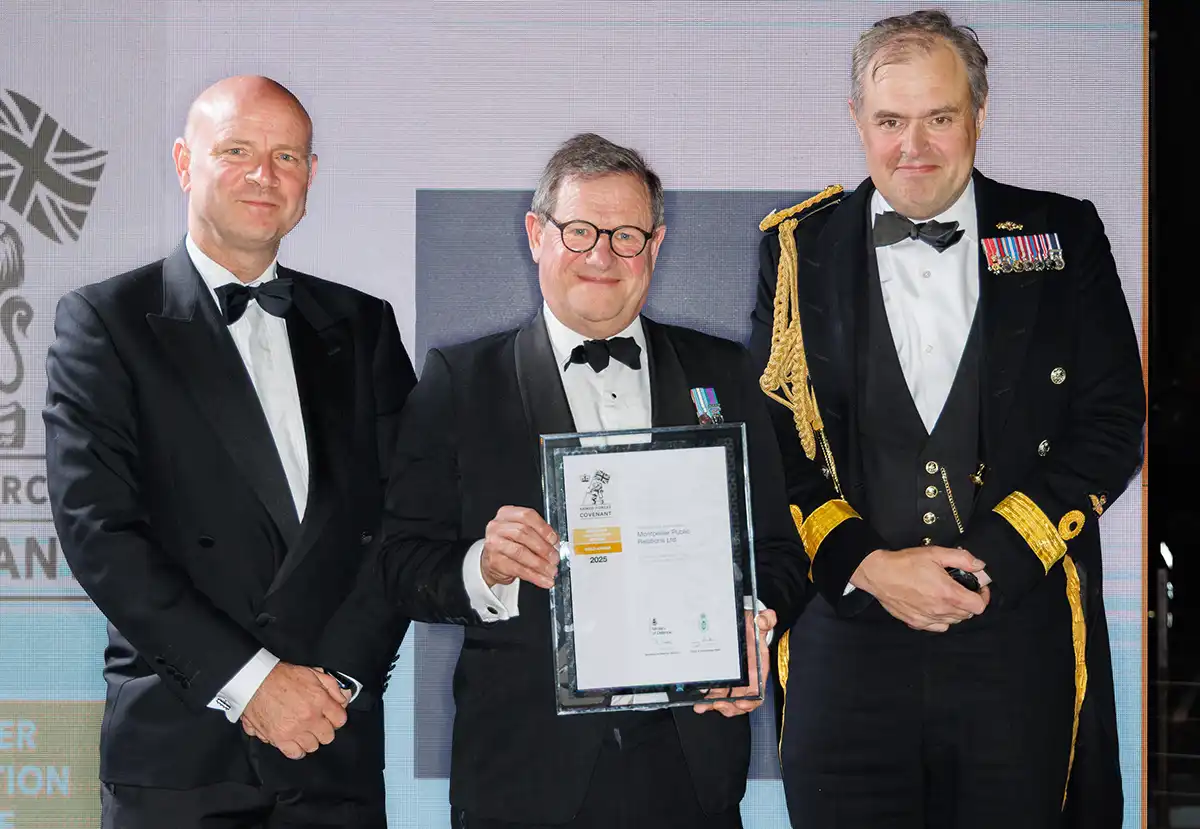 Roger Taylor and Guy Woodcock at the awards ceremony, with the Guy holding a framed Gold Employer Recognition Scheme (ERS) award certificate.